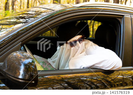 Ghost Driver Navigating Route With Map Inside Car 141576319