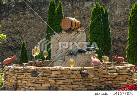 Beautiful stone wine fountain at Milestii Mici winery entrance Beautiful stone wine fountain at Milestii Mici winery entrance 141577876