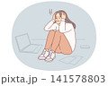 Upset cold woman suffering from stress or burnout, sitting on floor near papers and laptop 141578803