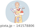 Business man in housewife apron is doing housework and cleaning or cooking after returning from work 141578806