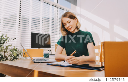Logistics, small business woman with checklist for stock, clothes order or retail inventory management. Shipping, writing or person at ecommerce startup store for sme delivery with fashion designer Logistics, small business woman with checklist for stock, clothes order or retail inventory management. Shipping, writing or person at ecommerce startup store for sme delivery with fashion designer 141579543