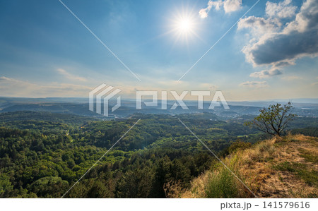 Layers of green mountains and hills in the haze during sunset. Panoramic View of Green hills and Meadow. Layers of green mountains and hills in the haze during sunset. Panoramic View of Green hills and Meadow. 141579616