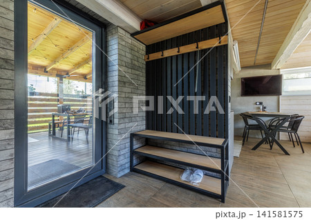 Modern Entrance Hallway Interior with Glass Door to Terrace Modern Entrance Hallway Interior with Glass Door to Terrace 141581575