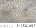 木漏れ日が差し込む石畳の背景素材 141581897