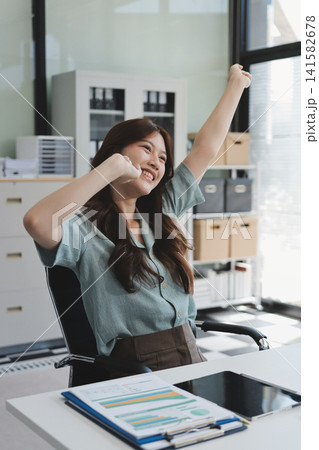 Woman experiencing neck pain due to office work 141582678
