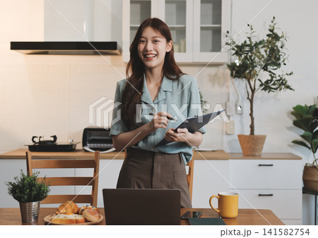 Young adult asian business woman using laptop chat digital artificial intelligence assistance ai chatbot prompt analysis work modern lifestyles 141582754