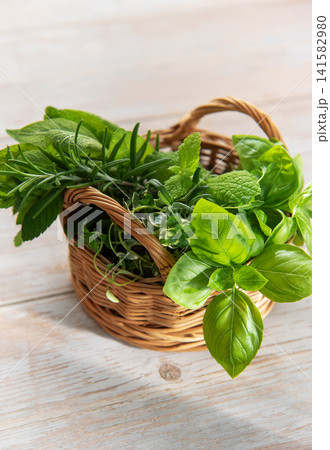 Basket of fresh garden herbs for cooking Basket of fresh garden herbs for cooking 141582980