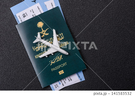 Saudi Arabia passport or id document with tickets for flight, travel. Saudi Arabia passport Saudi Arabia passport or id document with tickets for flight, travel. Saudi Arabia passport 141583532