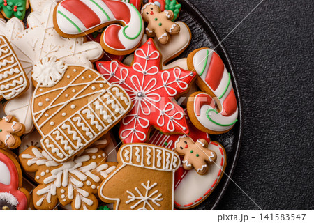 Gingerbread as a Christmas staple, sweet biscuits for the holiday table. Gingerbread as a backdrop Gingerbread as a Christmas staple, sweet biscuits for the holiday table. Gingerbread as a backdrop 141583547