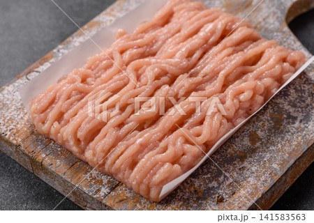 Fresh raw ground chicken, poultry meat for home cooking. Ground chicken 141583563