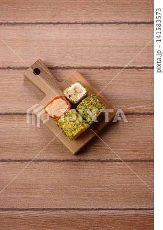 Turkish delight or lokum is a traditional Eastern sweet made with nuts. Turkish delight, lokum Turkish delight or lokum is a traditional Eastern sweet made with nuts. Turkish delight, lokum 141583573