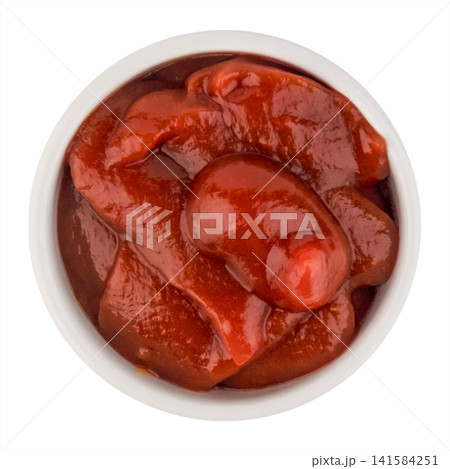 Top view of tomato paste or thick ketchup in a round white bowl isolated on white background Top view of tomato paste or thick ketchup in a round white bowl isolated on white background 141584251