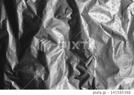 Foil crumpled texture wrinkled silver material abstract pattern surface background structure backdrop grey Foil crumpled texture wrinkled silver material abstract pattern surface background structure backdrop grey 141585398