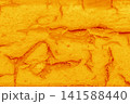 Cracked bright vibrant orange-yellow paint worn shabby old weathered surface texture abstract background pattern crack messy structure backdrop 141588440