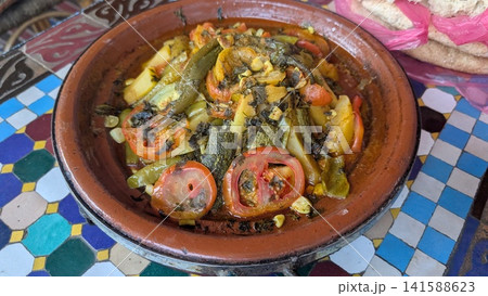 Traditional Moroccan Tagine with Meat and Sliced Tomatoes 141588623