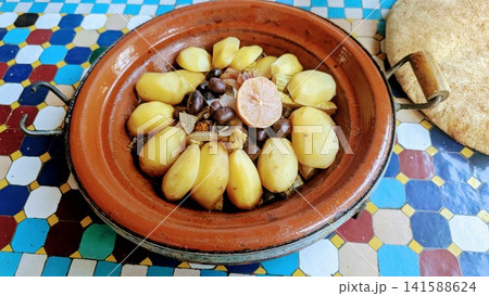 Traditional Moroccan Tagine with Potatoes Olives and Lemon Traditional Moroccan Tagine with Potatoes Olives and Lemon 141588624