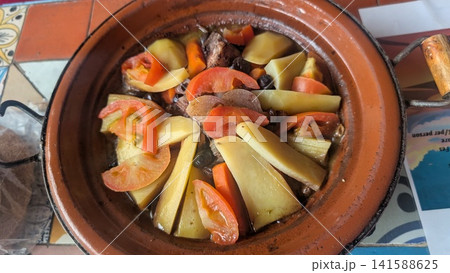 Traditional Moroccan Meat Tagine with Potatoes and Tomatoes Traditional Moroccan Meat Tagine with Potatoes and Tomatoes 141588625