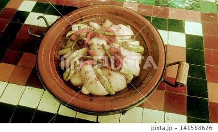 Traditional Moroccan Meat and Onion Tagine on Mosaic Table Traditional Moroccan Meat and Onion Tagine on Mosaic Table 141588626