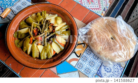 Traditional Moroccan Tagine with Green Peppers and Flatbread Traditional Moroccan Tagine with Green Peppers and Flatbread 141588627