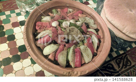 Traditional Moroccan Tagine with Garlic Cloves and Flatbread Traditional Moroccan Tagine with Garlic Cloves and Flatbread 141588628