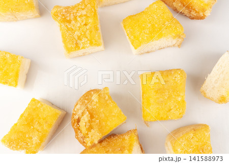 Bread with butter and sugar sprinkled on top piece pile Bread with butter and sugar sprinkled on top piece pile 141588973