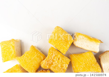 Bread with butter and sugar sprinkled on top piece pile Bread with butter and sugar sprinkled on top piece pile 141588974