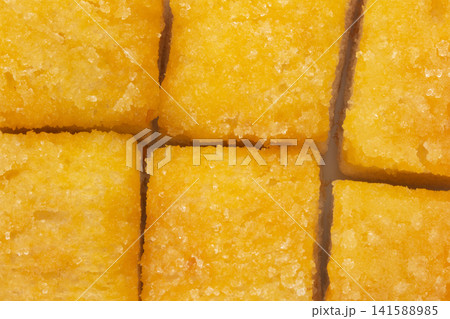Bread with butter and sugar sprinkled on top texture background 141588985