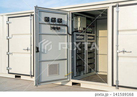 Industrial electrical cabinet with open doors revealing complex wiring and components Industrial electrical cabinet with open doors revealing complex wiring and components 141589168