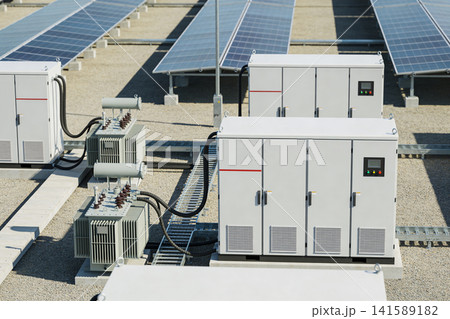 Solar power station with transformers and electrical cabinets on a rooftop Solar power station with transformers and electrical cabinets on a rooftop 141589182