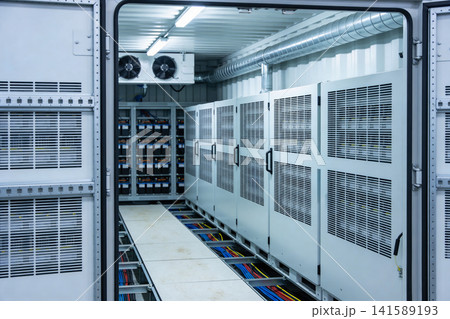 Inside a modern data center with rows of server racks and battery storage 141589193