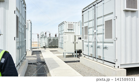 Modern electrical substation with large containers and transformers under sky Modern electrical substation with large containers and transformers under sky 141589331
