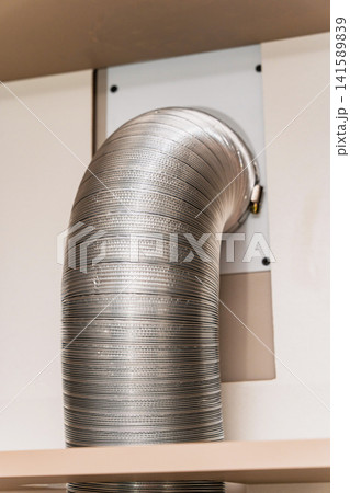 Duct installed in a kitchen area for ventilation and air flow management Duct installed in a kitchen area for ventilation and air flow management 141589839
