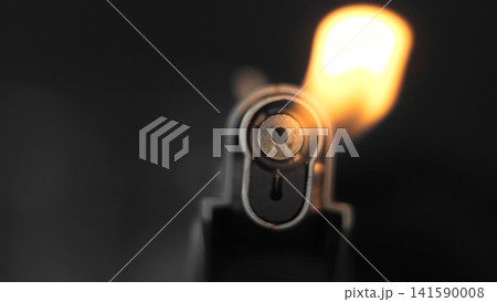Lighter flame igniting, providing warmth and light in a macro close-up, illustrating concepts of energy and heat Lighter flame igniting, providing warmth and light in a macro close-up, illustrating concepts of energy and heat 141590008