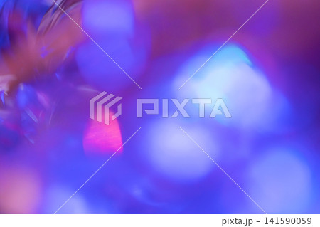 Abstract blurred background with vibrant purple and blue bokeh lights creating a colorful and dynamic visual effect suitable for various design applications Abstract blurred background with vibrant purple and blue bokeh lights creating a colorful and dynamic visual effect suitable for various design applications 141590059