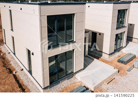 Modern modular houses under construction with contemporary design and large windows 141590225