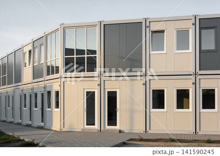Modern modular building constructed from stacked shipping containers Modern modular building constructed from stacked shipping containers 141590245