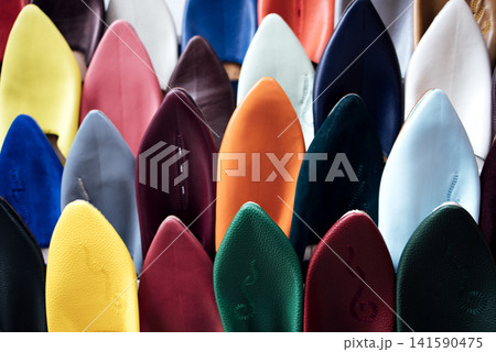 Colorful collection of high-heeled shoes displayed in a retail setting, showcasing various textures and materials, emphasizing fashion trends and stylish footwear options for modern consumers Colorful collection of high-heeled shoes displayed in a retail setting, showcasing various textures and materials, emphasizing fashion trends and stylish footwear options for modern consumers 141590475