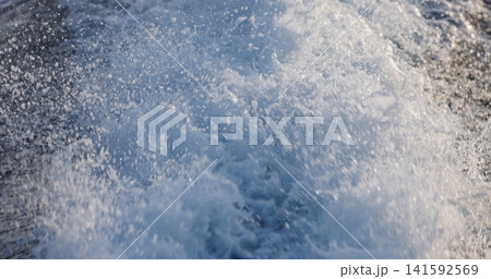 White foamy wake left by boat closeup White foamy wake left by boat closeup 141592569