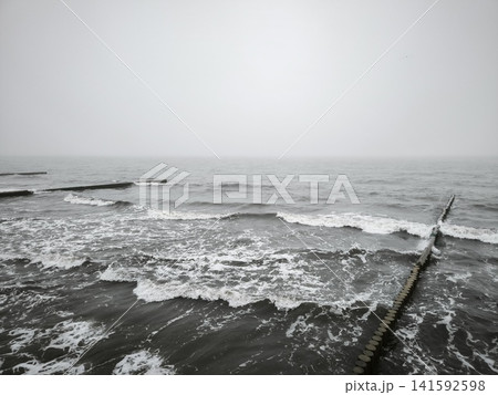 Wooden breakwater pillars withstand the onslaught of storm waves Wooden breakwater pillars withstand the onslaught of storm waves 141592598