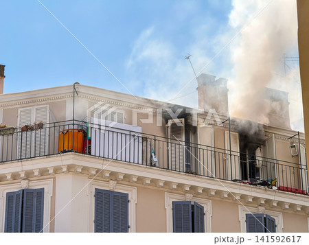 Close view of smoke above residential building Close view of smoke above residential building 141592617