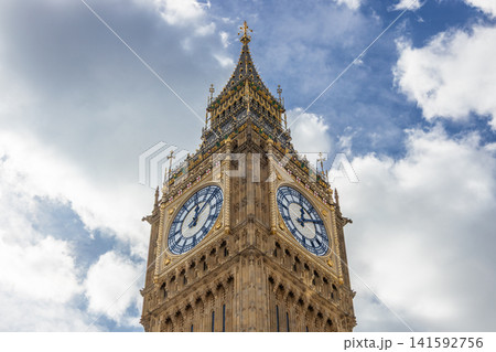 Big Ben clock tower against a cloudy blue sky in London Big Ben clock tower against a cloudy blue sky in London 141592756