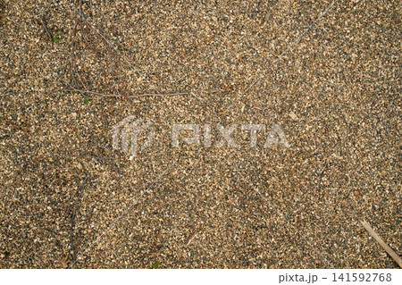 Smooth uniform layer of bulk river sediment sand and aggregate, providing an authentic texture pattern for website layouts Smooth uniform layer of bulk river sediment sand and aggregate, providing an authentic texture pattern for website layouts 141592768