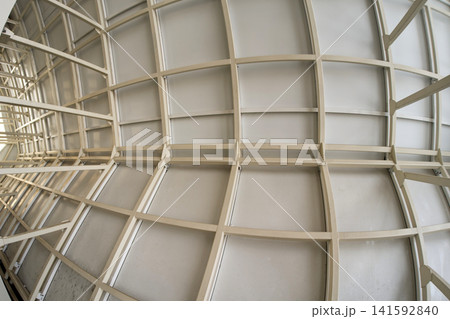 Abstract low angle view of contemporary architectural ceiling with glass panels and metal frame Abstract low angle view of contemporary architectural ceiling with glass panels and metal frame 141592840