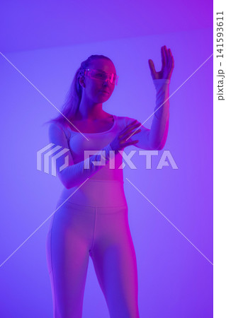 Woman in futuristic neon lighting 141593611