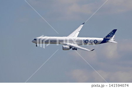 Russia Kubinka 12 April 2025. Airbus A350-1000 passenger aircraft performing during an air show. Modern twin-engine airliner in flight against blue sky. Aviation display at aerospace festival. Russia Kubinka 12 April 2025. Airbus A350-1000 passenger aircraft performing during an air show. Modern twin-engine airliner in flight against blue sky. Aviation display at aerospace festival. 141594074