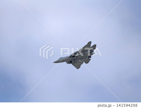 Russia Kubinka 12 April 2025. Su-57 fifth generation fighter jet performing aerobatics during an air show. Russian stealth aircraft in flight with smoke trails against blue sky Russia Kubinka 12 April 2025. Su-57 fifth generation fighter jet performing aerobatics during an air show. Russian stealth aircraft in flight with smoke trails against blue sky 141594208