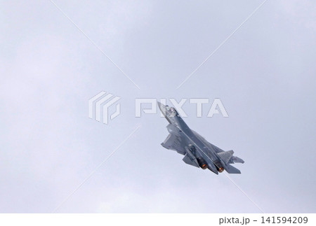 Russia Kubinka 12 April 2025. Su-57 fifth generation fighter jet performing aerobatics during an air show. Russian stealth aircraft in flight with smoke trails against blue sky Russia Kubinka 12 April 2025. Su-57 fifth generation fighter jet performing aerobatics during an air show. Russian stealth aircraft in flight with smoke trails against blue sky 141594209