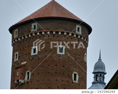 Krakow, Poland - August 6, 2023: Brick Facade of Wawel Senator Tower 141594244