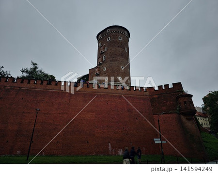 Krakow, Poland - August 6, 2023: Massive Defensive Wall of Wawel Castle Krakow, Poland - August 6, 2023: Massive Defensive Wall of Wawel Castle 141594249