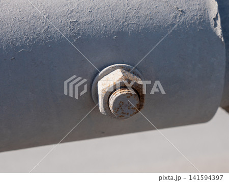 Large nut on metal pipe industrial close up mechanical connection plumbing and engineering detail concept. Large nut on metal pipe industrial close up mechanical connection plumbing and engineering detail concept. 141594397